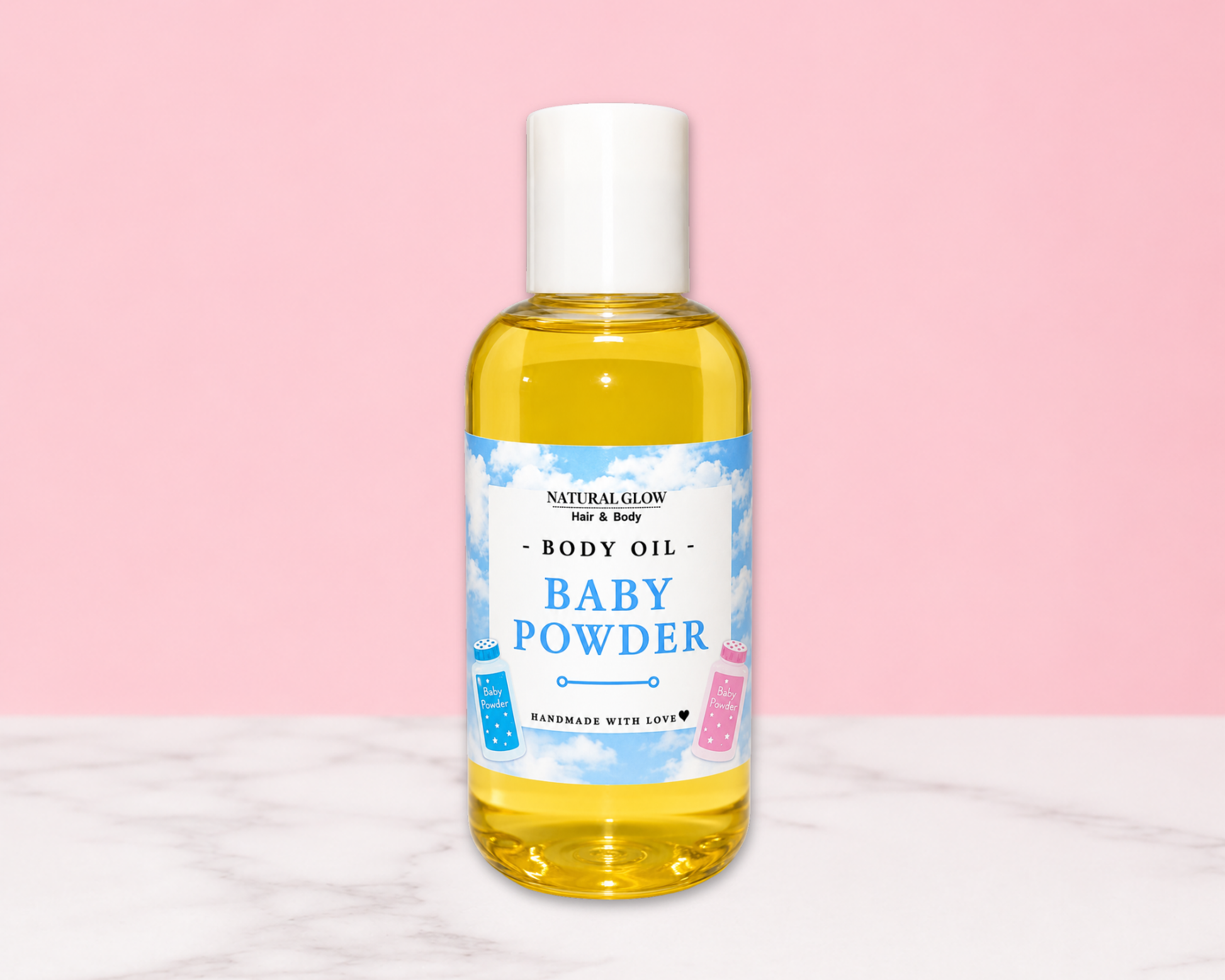 A bottle of Natural Glow For & Baby Baby Powder Body Oil, filled with yellow liquid and featuring a white cap, set against a pink background with a white marble surface.