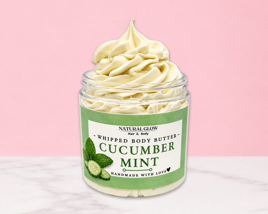Natural Glow Cucumber Mint whipped body butter in a jar with cream-colored butter swirl, pink background, and white marble surface