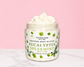Natural Glow Eucalyptus & Spearmint whipped body butter in a jar with cream-colored butter swirl, pink background, and white marble surface