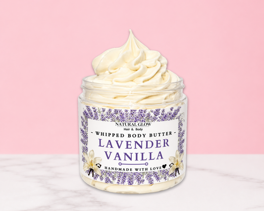 Natural Glow Lavender Vanilla whipped body butter in a jar with cream-colored butter swirl, pink background, and white marble surface