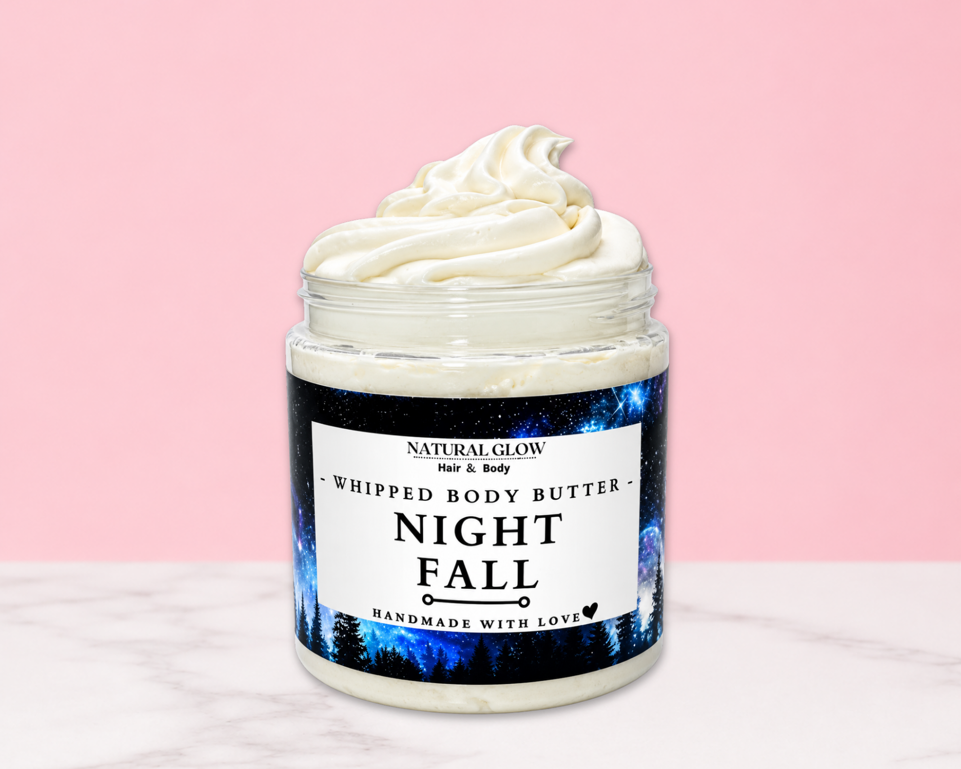 Natural Glow Night Fall mens whipped body butter in a jar with cream-colored butter swirl, pink background, and white marble surface