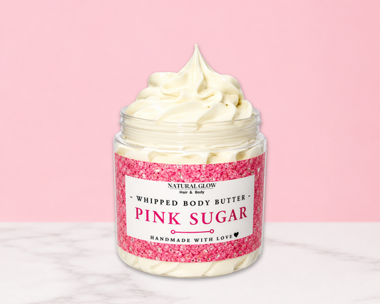 Natural Glow Pink Sugar whipped body butter in a jar with cream-colored butter swirl, pink background, and white marble surface