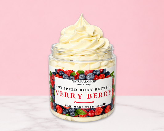 Natural Glow Very Berry whipped body butter in a jar with cream-colored butter swirl, pink background, and white marble surface