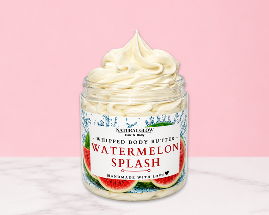 Natural Glow Watermelon Splash whipped body butter in a jar with cream-colored butter swirl, pink background, and white marble surface