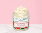 Natural Glow Watermelon Splash whipped body butter in a jar with cream-colored butter swirl, pink background, and white marble surface