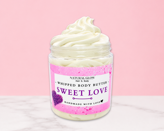 Natural Glow Sweet Love whipped body butter in a jar with cream-colored butter swirl, pink background, and white marble surface