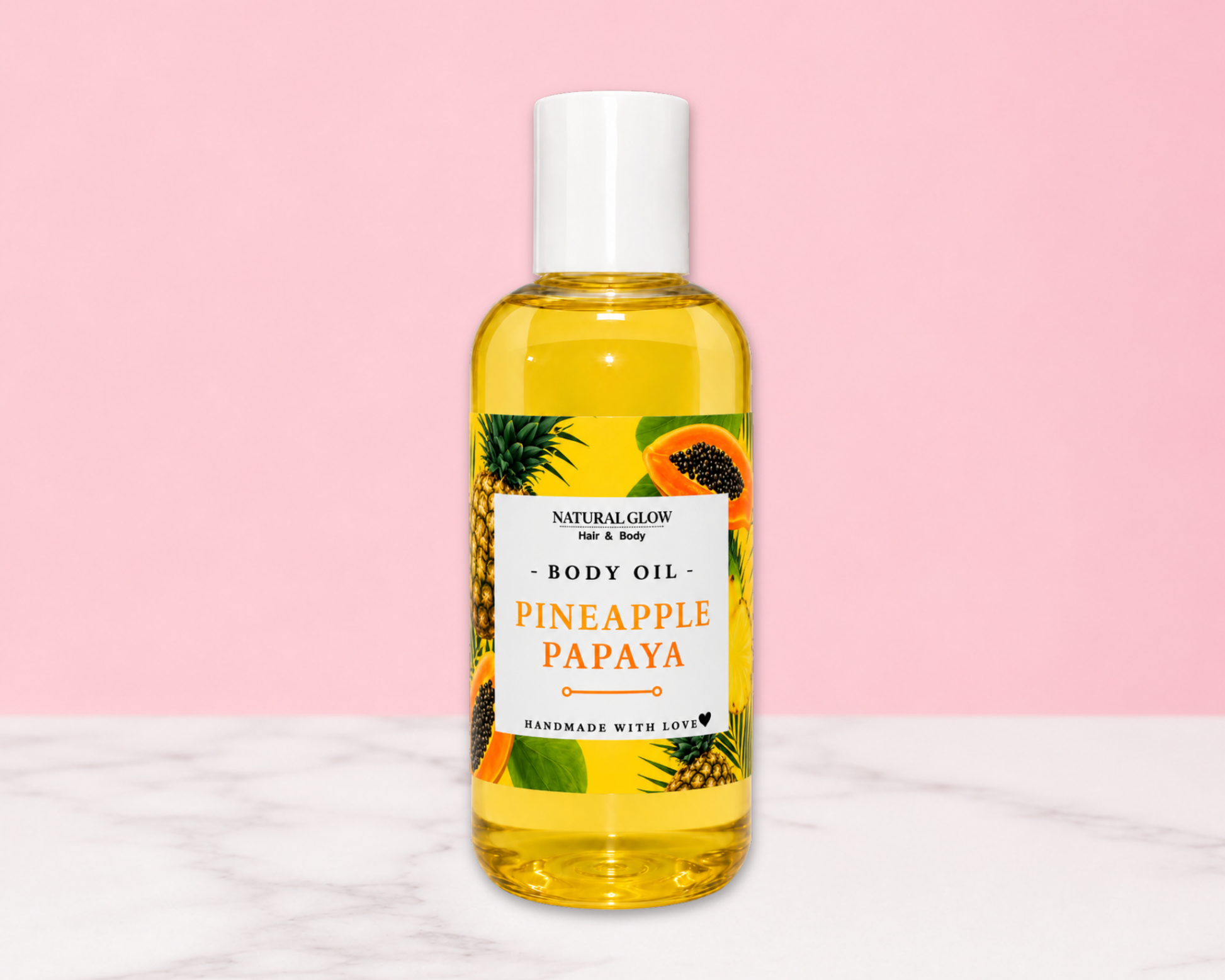 A bottle of Natural Glow Pineapple Papaya body oil, filled with yellow oil and featuring a white cap, set against a pink background with a white marble surface.